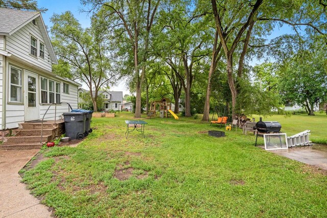 413 S Howard St, Princeton, WI 54968 - view of green lawn featuring a playground
