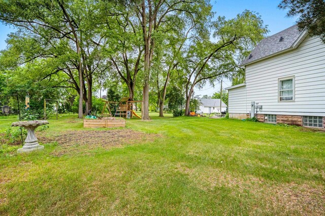 413 S Howard St, Princeton, WI 54968 - view of grassy yard featuring a playground