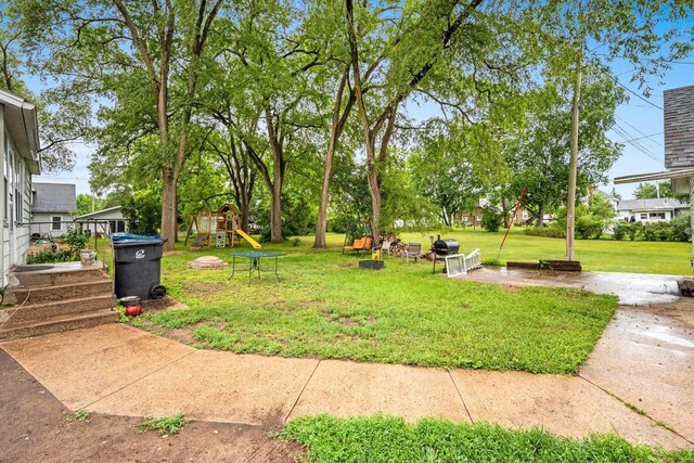 413 S Howard St, Princeton, WI 54968 - view of grassy yard with a playground