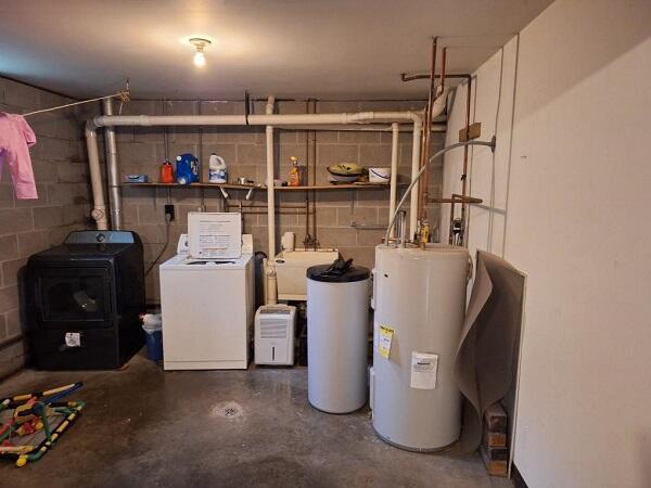 113/115 Oak St, Stoddard, WI 54658 - utility room with water heater and washing machine and dryer