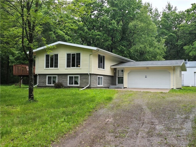 2104 US Highway 8, Cameron, WI 54822 - tri-level home featuring driveway, a garage, a front yard, a deck, and stone siding