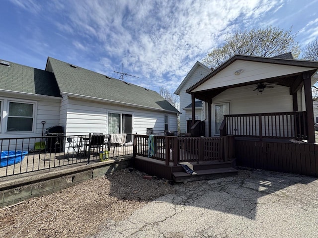 414 Barney St Unit 418, Waukesha, WI 53186 - back of house featuring a shingled roof, ceiling fan, a patio, and a deck