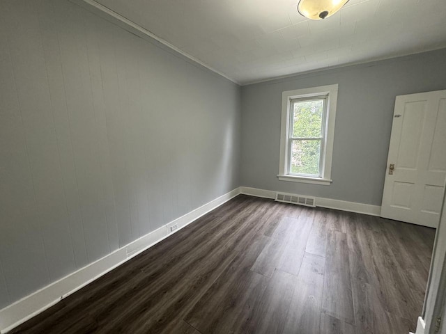 414 Barney St Unit 418, Waukesha, WI 53186 - unfurnished room with dark wood finished floors and crown molding