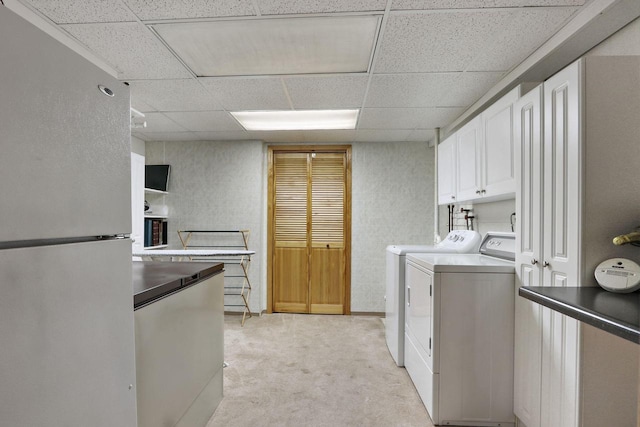 32665 Academy Rd, Burlington, WI 53105 - laundry area featuring washer and dryer, light colored carpet, and cabinet space