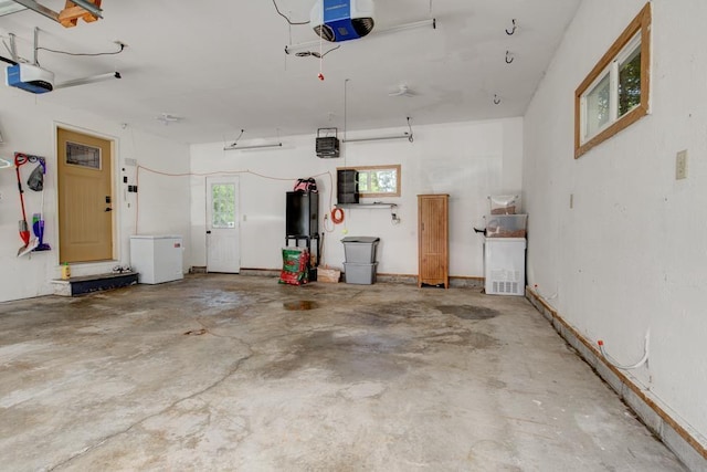 1410 Edwin St, Marinette, WI 54143 - garage with a garage door opener and fridge