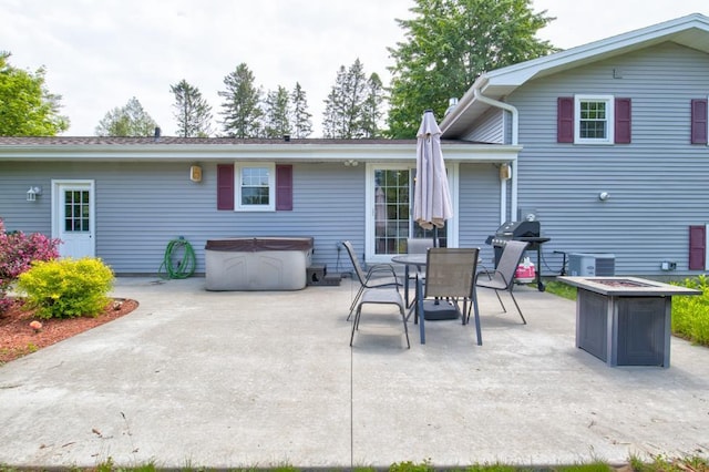 1410 Edwin St, Marinette, WI 54143 - view of patio / terrace with a hot tub, grilling area, and outdoor dining area