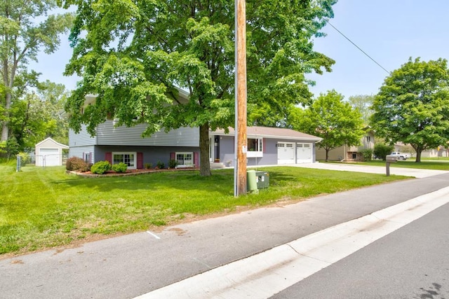 1410 Edwin St, Marinette, WI 54143 - split level home featuring concrete driveway and an attached garage