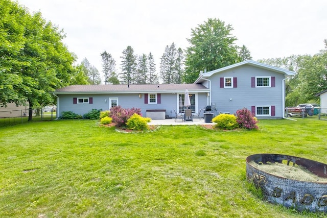 1410 Edwin St, Marinette, WI 54143 - back of property with an outdoor fire pit and a patio