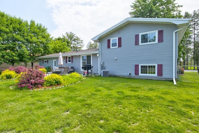 1410 Edwin St, Marinette, WI 54143 - rear view of property with a yard and a patio