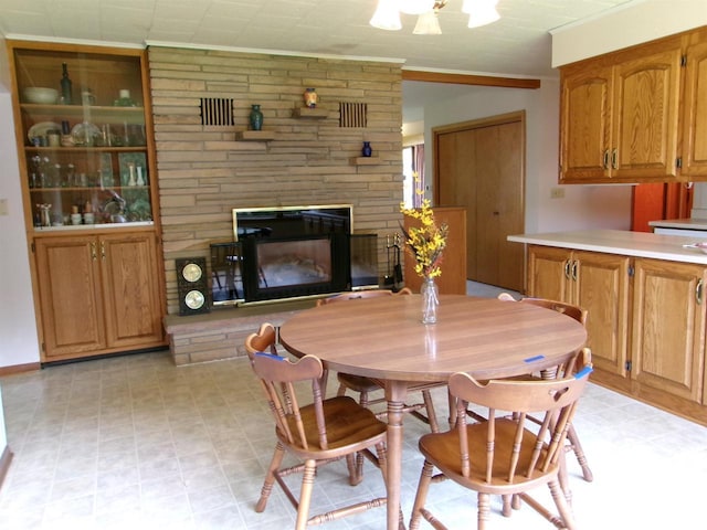 116 Mohawk Dr, Beaver Dam, WI 53916 - dining room featuring crown molding and a stone fireplace