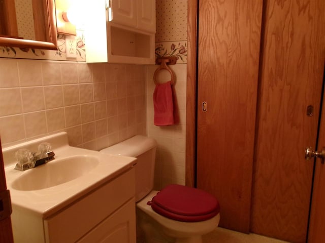 116 Mohawk Dr, Beaver Dam, WI 53916 - half bathroom with vanity and decorative backsplash