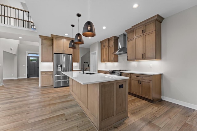 N65W34963 Baltic Pass, Oconomowoc, WI 53066 - kitchen with wall chimney range hood, stainless steel refrigerator with ice dispenser, light wood-style floors, light countertops, and recessed lighting