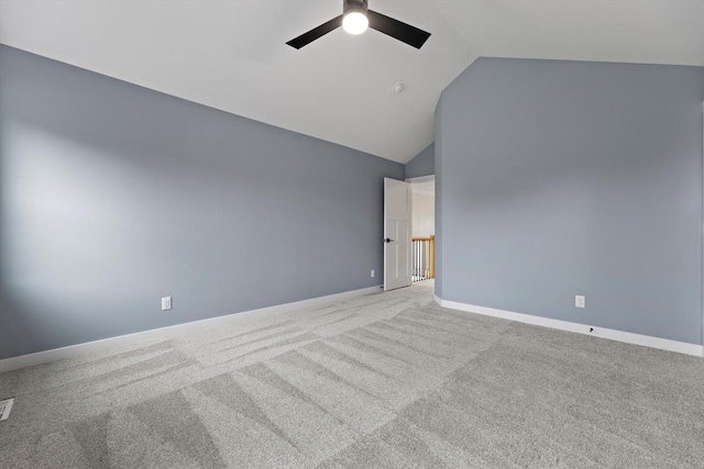 N65W34963 Baltic Pass, Oconomowoc, WI 53066 - unfurnished room with a ceiling fan, vaulted ceiling, and carpet flooring