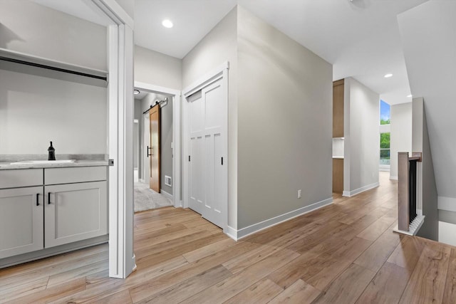 N65W34963 Baltic Pass, Oconomowoc, WI 53066 - hall with light wood-style floors, recessed lighting, and an upstairs landing