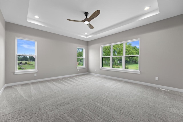 N65W34963 Baltic Pass, Oconomowoc, WI 53066 - spare room with a raised ceiling, recessed lighting, a ceiling fan, and carpet floors