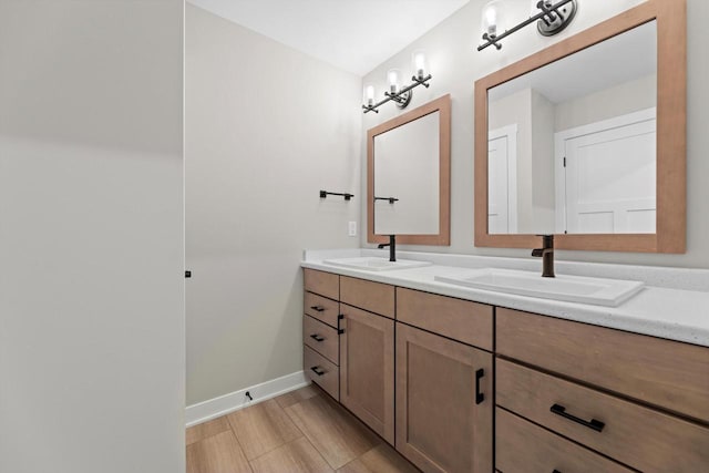 N65W34963 Baltic Pass, Oconomowoc, WI 53066 - bathroom featuring double vanity and baseboards