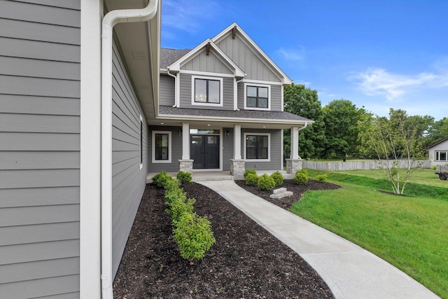 N65W34963 Baltic Pass, Oconomowoc, WI 53066 - craftsman house featuring board and batten siding, a front lawn, and a porch