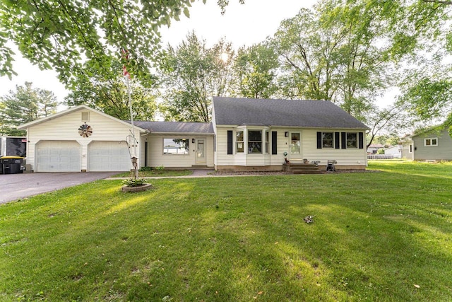 1116 Lagrange Ave, Tomah, WI 54660 - view of front of property featuring a garage, driveway, and a front lawn