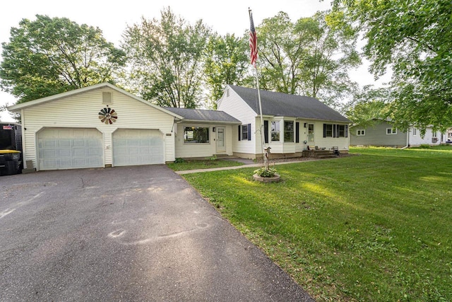 1116 Lagrange Ave, Tomah, WI 54660 - ranch-style home featuring an attached garage, driveway, a front lawn, and a shingled roof