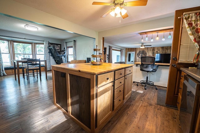 1116 Lagrange Ave, Tomah, WI 54660 - kitchen featuring a ceiling fan, butcher block countertops, dark wood-style flooring, decorative light fixtures, and a textured ceiling