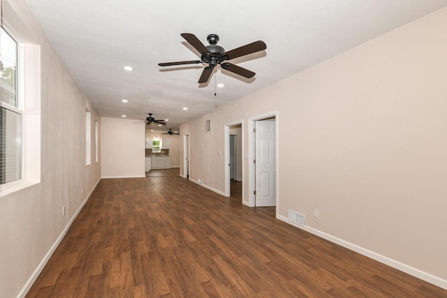 1963 S 20th St, Milwaukee, WI 53204 - unfurnished living room with dark wood-style flooring, ceiling fan, recessed lighting, and plenty of natural light