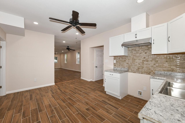 1963 S 20th St, Milwaukee, WI 53204 - kitchen featuring under cabinet range hood, a ceiling fan, backsplash, white cabinets, and recessed lighting
