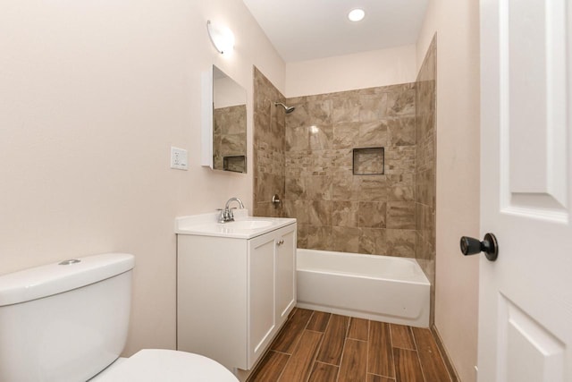 1963 S 20th St, Milwaukee, WI 53204 - full bathroom with vanity, washtub / shower combination, wood tiled floors, and recessed lighting