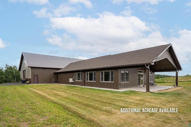 4304 E Leggate Rd, Superior, WI 54880 - rear view of property with a lawn and a patio area