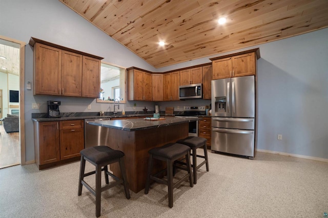 4304 E Leggate Rd, Superior, WI 54880 - kitchen featuring stainless steel appliances, wood ceiling, a breakfast bar area, a kitchen island, and lofted ceiling
