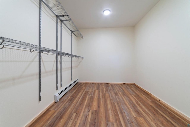 4304 E Leggate Rd, Superior, WI 54880 - walk in closet with a baseboard radiator and wood finished floors