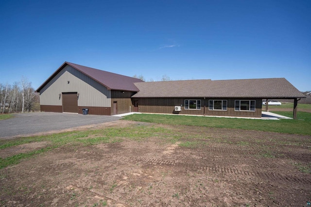 4304 E Leggate Rd, Superior, WI 54880 - view of front of house with a garage, a front yard, and a shingled roof