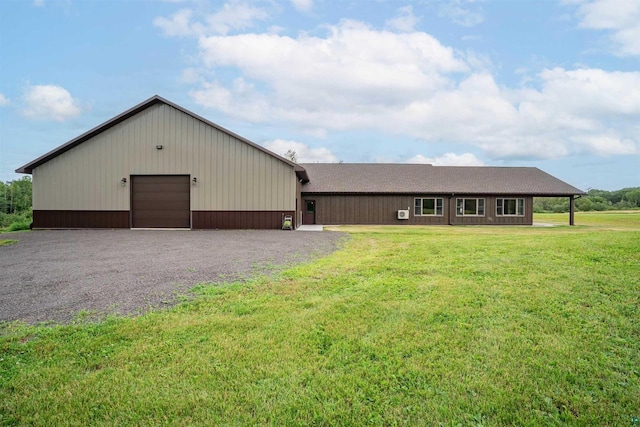4304 E Leggate Rd, Superior, WI 54880 - view of front of property with a front yard, a garage, and gravel driveway