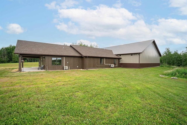 4304 E Leggate Rd, Superior, WI 54880 - back of property featuring a lawn and a patio area