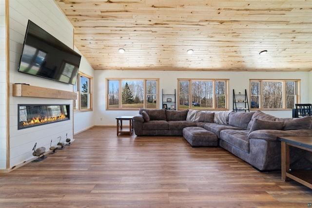 4304 E Leggate Rd, Superior, WI 54880 - living area featuring a fireplace, wooden ceiling, vaulted ceiling, and wood finished floors