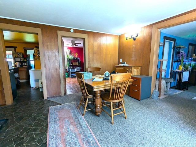 225 Caledonia St, La Crosse, WI 54603 - dining room with wood walls and stone flooring