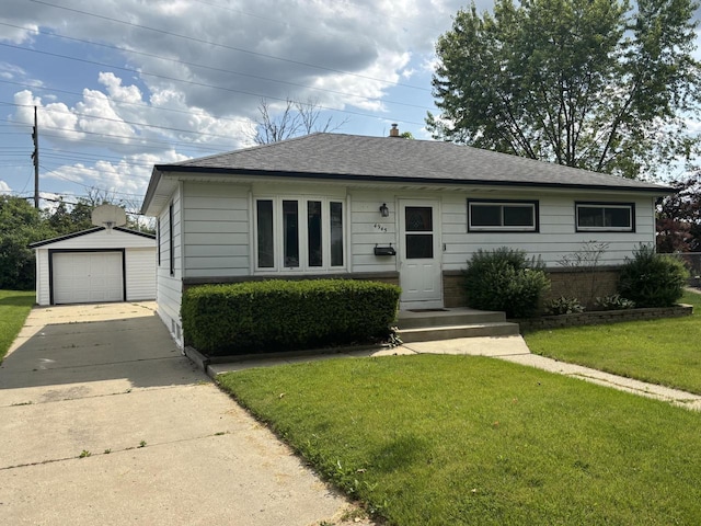 4945 W Tesch Ave, Milwaukee, WI 53220 - view of front of home featuring driveway, a front lawn, roof with shingles, and an outbuilding
