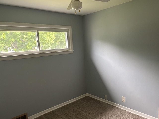 4945 W Tesch Ave, Milwaukee, WI 53220 - unfurnished room with ceiling fan and dark carpet
