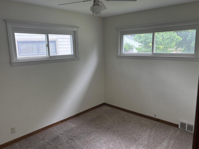 4945 W Tesch Ave, Milwaukee, WI 53220 - carpeted spare room featuring healthy amount of natural light and ceiling fan