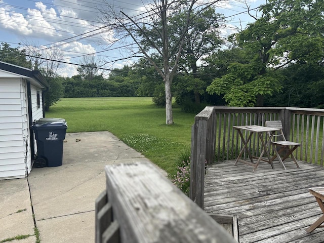 4945 W Tesch Ave, Milwaukee, WI 53220 - wooden deck with a lawn and view of wooded area