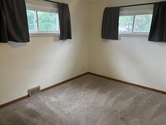 4945 W Tesch Ave, Milwaukee, WI 53220 - carpeted empty room featuring plenty of natural light