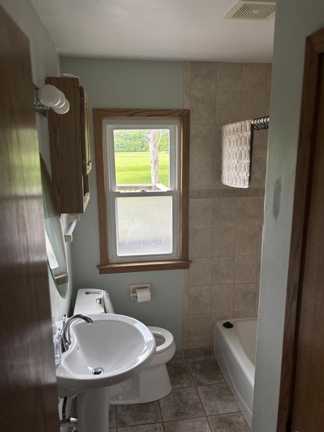 4945 W Tesch Ave, Milwaukee, WI 53220 - bathroom featuring toilet and tile patterned flooring