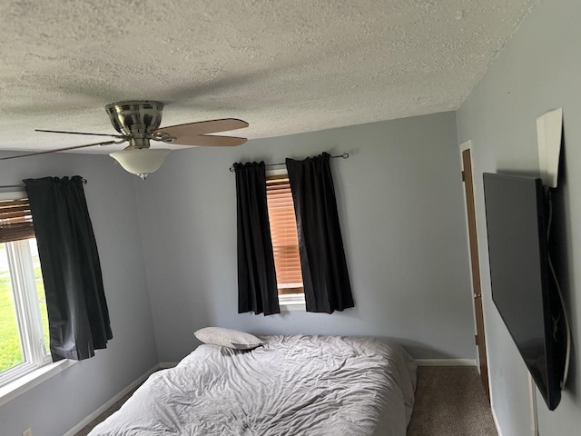 4945 W Tesch Ave, Milwaukee, WI 53220 - bedroom featuring a textured ceiling, a ceiling fan, and carpet