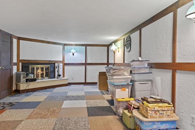 611 Mount Snowdon Rd, Wales, WI 53183 - living area featuring a textured wall and a glass covered fireplace