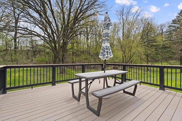 611 Mount Snowdon Rd, Wales, WI 53183 - wooden deck featuring a lawn and outdoor dining space