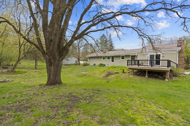 611 Mount Snowdon Rd, Wales, WI 53183 - view of grassy yard with a deck