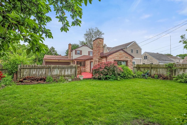 5463 N Lydell Ave, Glendale, WI 53217 - rear view of property with a fenced backyard, a chimney, a deck, and brick siding