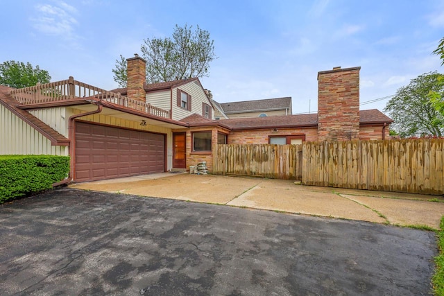 5463 N Lydell Ave, Glendale, WI 53217 - multi unit property featuring a chimney, a garage, and asphalt driveway