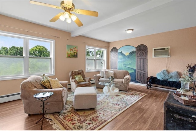 110 1st Ave, Balsam Lake, WI 54810 - living area with a wall unit AC, beamed ceiling, wood finished floors, a baseboard heating unit, and a ceiling fan