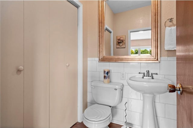 110 1st Ave, Balsam Lake, WI 54810 - half bathroom with toilet and tile walls