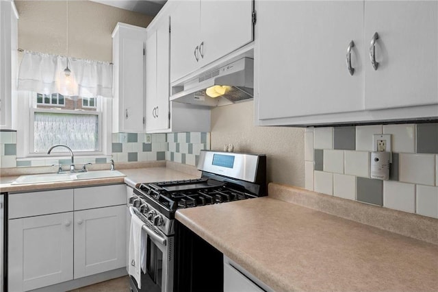 110 1st Ave, Balsam Lake, WI 54810 - kitchen featuring stainless steel gas stove, under cabinet range hood, tasteful backsplash, white cabinets, and light countertops